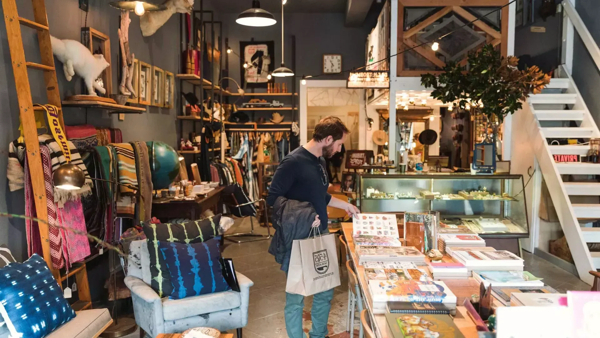 A man shops for items inside a boutique in San Francisco's NoPa neighborhood.